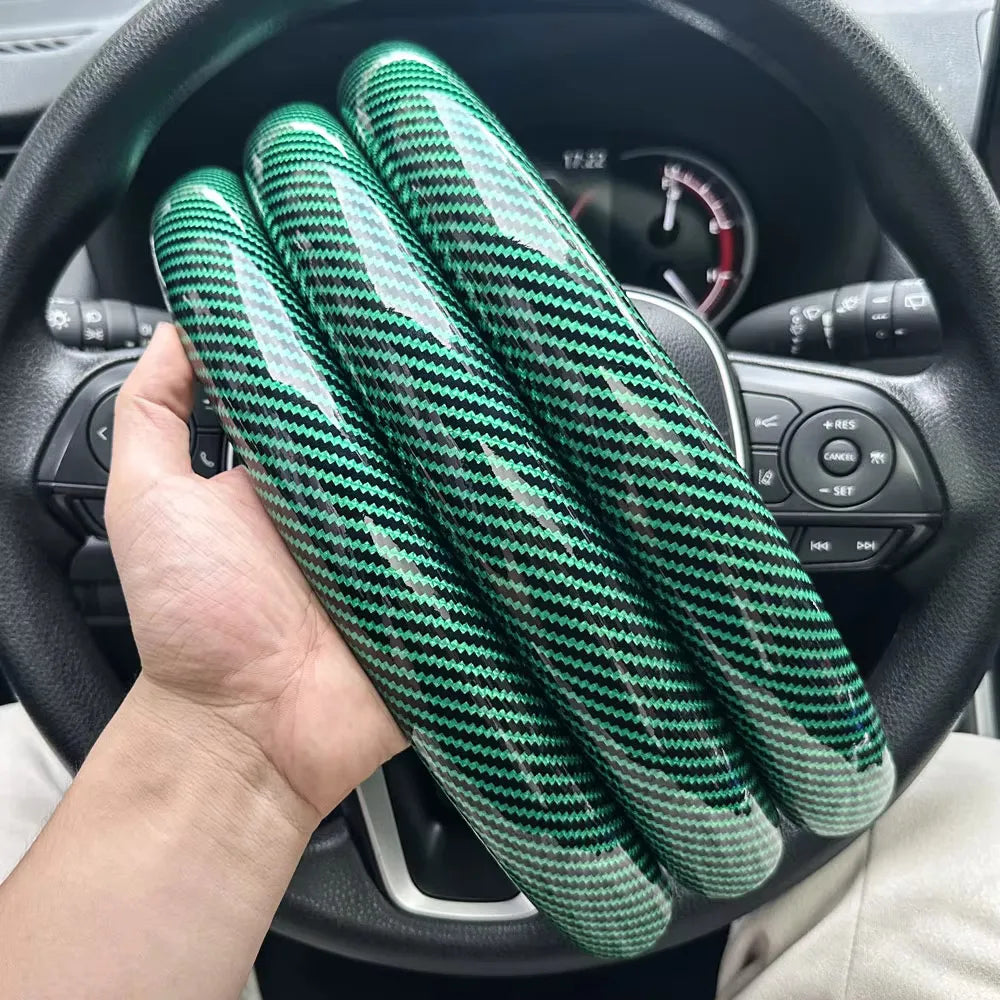 Carbon fiber silicone steering wheel cover 3 piece set.