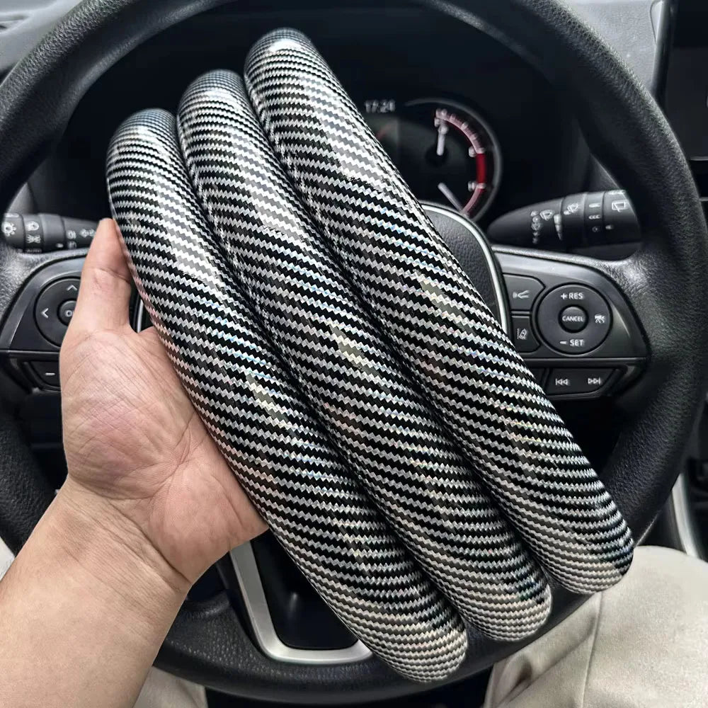 Carbon fiber silicone steering wheel cover 3 piece set.