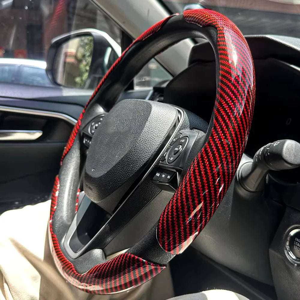 Carbon fiber silicone steering wheel cover 3 piece set.