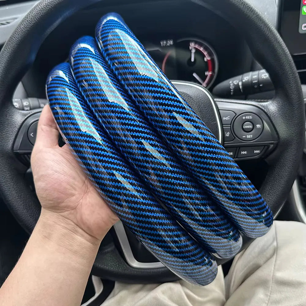 Carbon fiber silicone steering wheel cover 3 piece set.