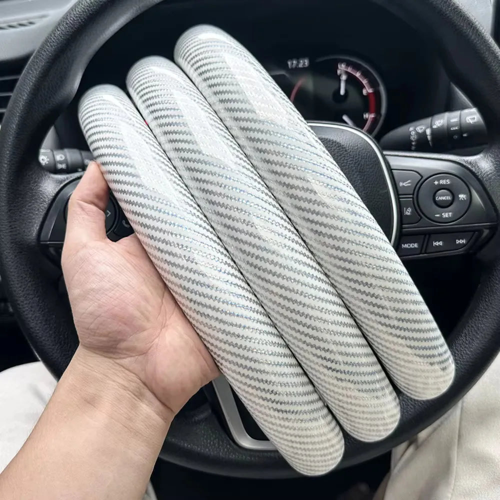 Carbon fiber silicone steering wheel cover 3 piece set.
