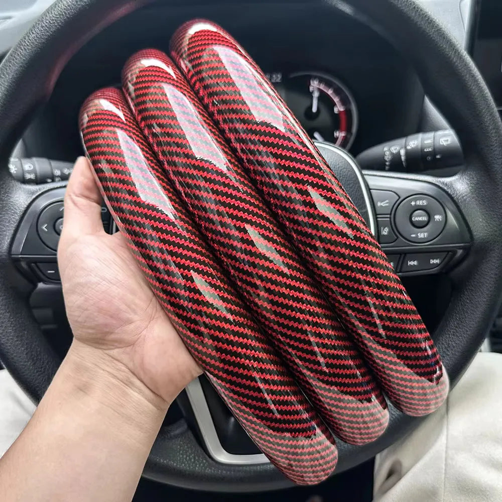 Carbon fiber silicone steering wheel cover 3 piece set.