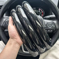 Carbon fiber silicone steering wheel cover 3 piece set.