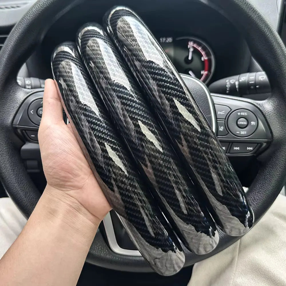 Carbon fiber silicone steering wheel cover 3 piece set.